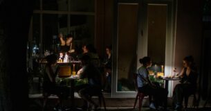 SAN JUAN, PUERTO RICO - APRIL 16: People have dinner at chinese restaurant Santurce during a massive power blackout that affected the entire island on April 16, 2025 in San Juan, Puerto Rico. The cause of the electricity outage is being investigated after all 1.4 million residents of the island lost power on Wednesday. (Photo by Jose Jimenez/Getty Images)