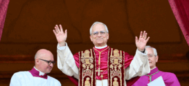TOPSHOT - Newly elected Pope Leo XIV, Robert Francis Prevost arrives on the main central loggia balcony of the St Peter's Basilica for the first time, after the cardinals ended the conclave, in The Vatican, on May 8, 2025. Robert Francis Prevost was on Thursday elected the first pope from the United States, the Vatican announced. A moderate who was close to Pope Francis and spent years as a missionary in Peru, he becomes the Catholic Church's 267th pontiff, taking the papal name Leo XIV. (Photo by Alberto PIZZOLI / AFP) (Photo by ALBERTO PIZZOLI/AFP via Getty Images)
